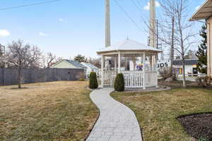 View of yard featuring a gazebo and fence