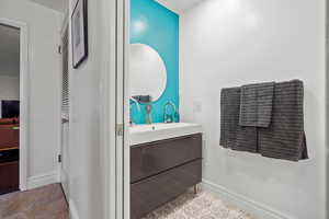 Bathroom with vanity and baseboards