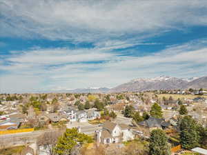 Exterior space featuring a residential view and a mountain view