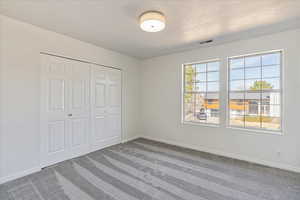 Upstairs bedroom #2 with new carpeting.