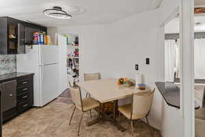 Dining room featuring stone finish floor