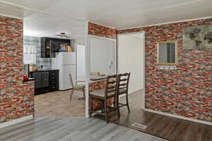 Dining room with visible vents and wood finished floors