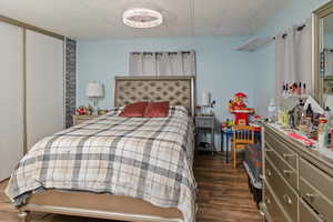 Bedroom with dark wood finished floors