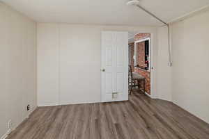 Spare room with wood finished floors