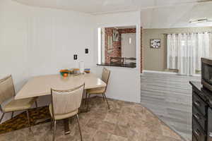 Dining space with wood finished floors