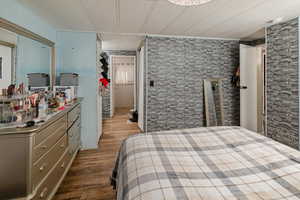 Bedroom with dark wood finished floors