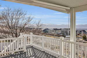 Wooden terrace featuring a mountain view and a residential view