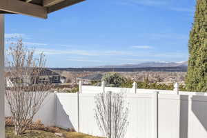 Exterior space with fence and a mountain view