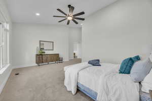 Bedroom with visible vents, light carpet, a ceiling fan, recessed lighting, and baseboards