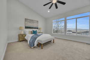 Bedroom featuring recessed lighting, baseboards, lofted ceiling, and light colored carpet