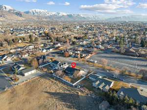 Drone / aerial view featuring a mountain view and a residential view