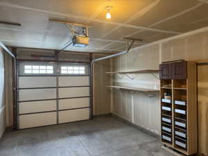 Garage featuring a garage door opener