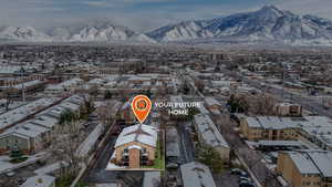 Birds eye view of property featuring a mountain view and a residential view