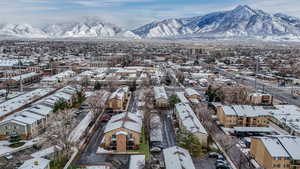 Snowy aerial view with a residential view and a mountain view