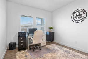 Office featuring baseboards and wood finished floors