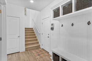 Mudroom featuring light wood-style flooring