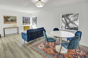 Dining room featuring baseboards and wood finished floors