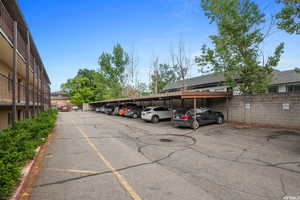 Partially covered parking lot with fence