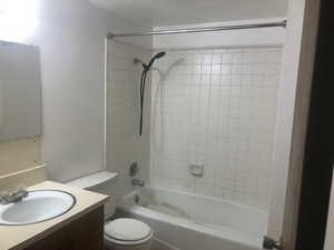 Bathroom with vanity, toilet, and shower / bath combination