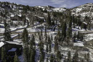 Snowy aerial view featuring a mountain view