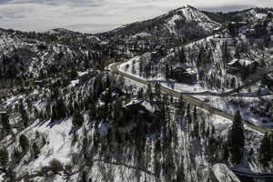 Snowy aerial view featuring a mountain view