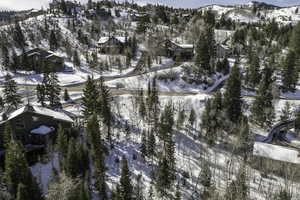 Snowy aerial view featuring a mountain view