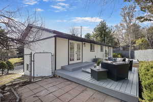 Deck right off primary bedroom & Backyard space.