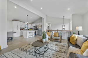 Open concept main living area: Kitchen, living area and dining area.