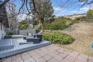 Deck right off primary bedroom & Backyard space showing terraced yard.