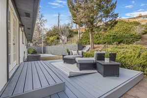 Deck right off primary bedroom & Backyard space.