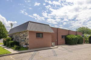 View of property and uncovered parking