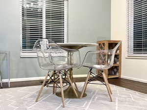 Dining area featuring baseboards and wood finished floors