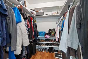 Spacious closet with wood finished floors