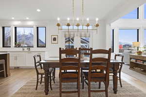 Dining space featuring visible vents, recessed lighting, and light wood-type flooring