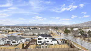 Drone / aerial view with a mountain view and a residential view