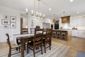 Dining area with recessed lighting, baseboards, and light wood-style floors