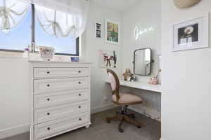 Office featuring baseboards and carpet