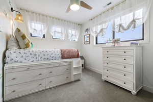 Bedroom featuring visible vents, carpet floors, baseboards, and a ceiling fan