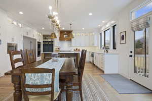 Dining room with recessed lighting and light wood finished floors