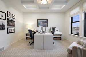 Home office featuring carpet, baseboards, and coffered ceiling