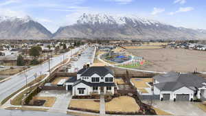 Birds eye view of property featuring a mountain view and a residential view