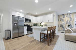 Kitchen with recessed lighting, stainless steel appliances, and light countertops