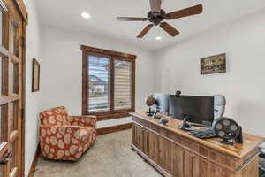 Office area featuring light carpet, recessed lighting, baseboards, and a ceiling fan