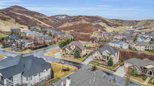 Drone / aerial view featuring a mountain view and a residential view