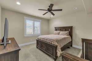 Bedroom featuring recessed lighting, baseboards, and light carpet