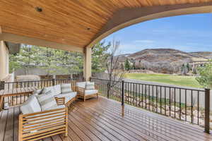 Deck with a mountain view and an outdoor hangout area