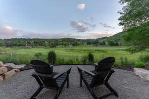 View of patio / terrace featuring a mountain view and an outdoor fire pit