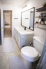 Bathroom with toilet and vanity