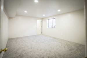 bedroom with walk in closet recessed lighting