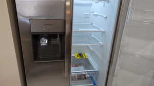 Room details with refrigerator with ice dispenser